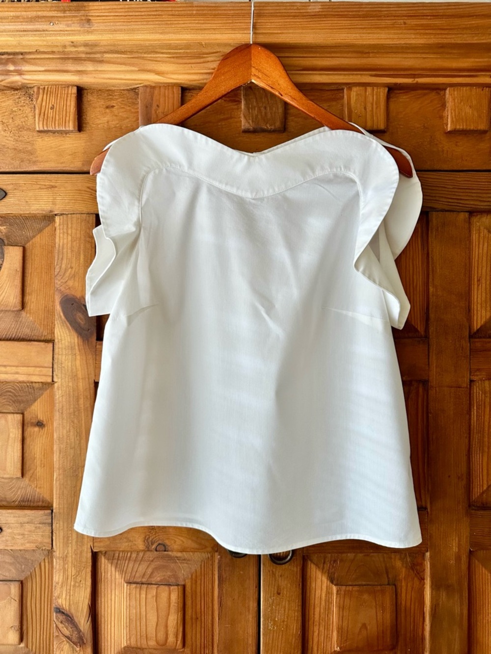 Belle Sky White Ruffle-Trim Sleeveless Blouse